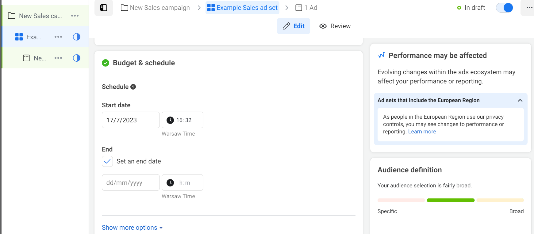 
A campaign setup interface for a sales campaign. On the left, the campaign structure is displayed with a folder labeled New Sales campaign and an ad set named Example Sales ad set. On the right, the Budget & schedule section shows a start date of 17/7/2023 at 16:32 Warsaw Time, with an option to set an end date. A section titled Performance may be affected explains that changes in the ads ecosystem and privacy controls in the European Region may impact performance or reporting, with a Learn more link. Below, the Audience definition section indicates the audience selection is fairly broad, with a visual bar spanning from specific to broad. At the top, the campaign status is shown as In draft with a toggle button.