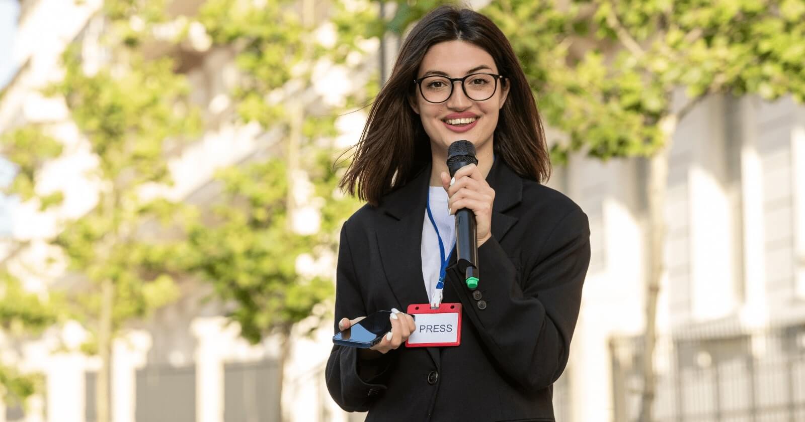 The photo shows a smiling female journalist.