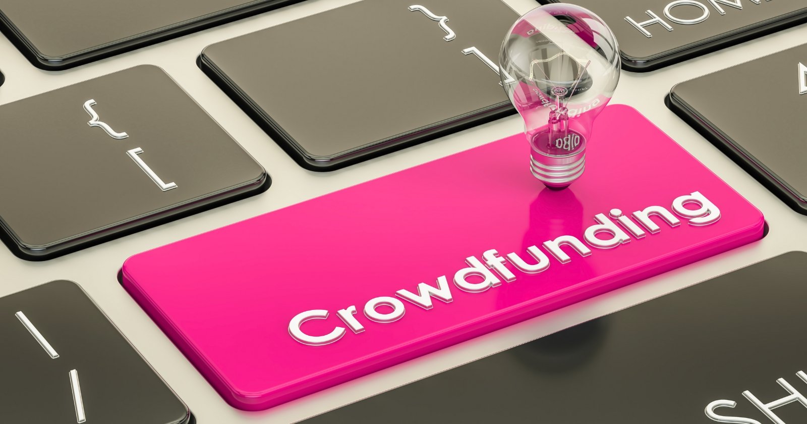 The photo shows a pink keyboard key with the word Crowdfunding written on it.