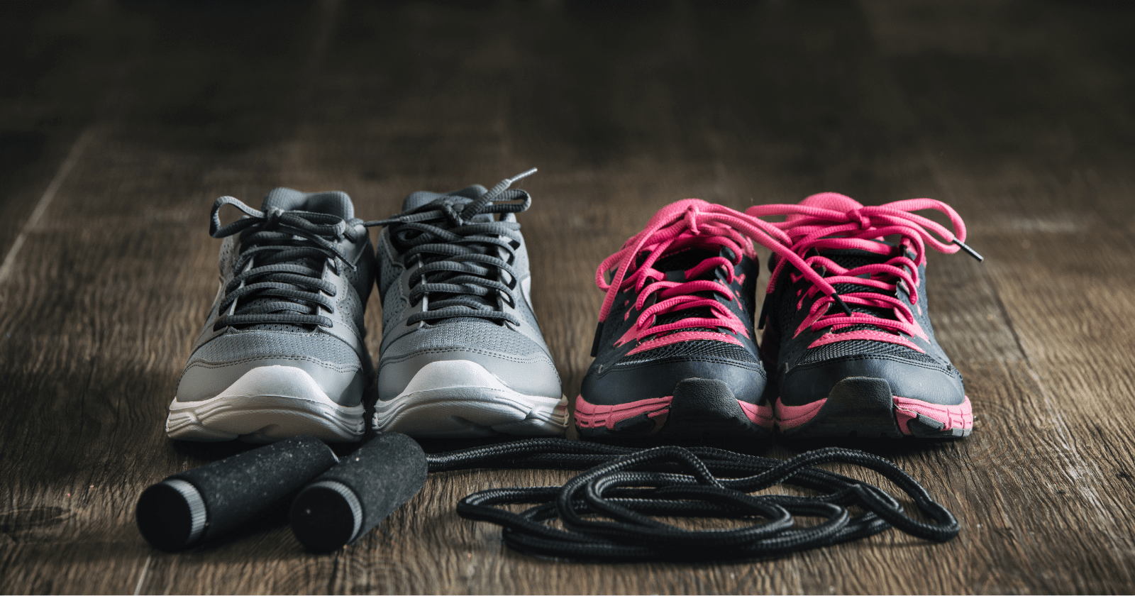 Photo shows two pairs of gym shoes and a skipping rope.
